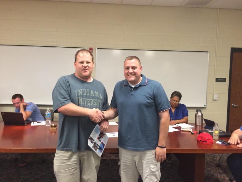 Lt. Andrew Coady being welcomed as a Life Member of the GVFD by President Matt Hermanson